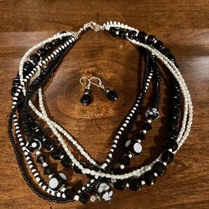 Black and white beaded necklace and earrings with sterling silver clasp.